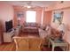 Living room with two couches and wicker chair, hardwood floors at 329 54Th Ave. N, North Myrtle Beach, SC 29582