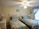 Guest bedroom with two twin beds, coastal bedding, and a dresser at 329 54Th Ave. N, North Myrtle Beach, SC 29582