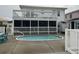 Inviting kidney-shaped pool with a surrounding patio at 329 54Th Ave. N, North Myrtle Beach, SC 29582