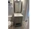 Clean bathroom with gray vanity, updated fixtures, and a large mirror at 329 54Th Ave. N, North Myrtle Beach, SC 29582