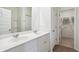 Double vanity bathroom with white cabinets and a walk-in closet at 115 Talladega Dr. # 405, Myrtle Beach, SC 29579