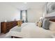 Main bedroom with king bed, dresser, and sitting chair at 115 Talladega Dr. # 405, Myrtle Beach, SC 29579