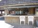 Beachfront bar with outdoor seating and a thatched roof at 9550 Shore Dr. # 619, Myrtle Beach, SC 29572