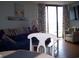 Comfortable living room with access to balcony and ocean view at 9550 Shore Dr. # 619, Myrtle Beach, SC 29572