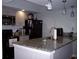 Modern kitchen with granite countertops and stainless steel appliances at 9550 Shore Dr. # 619, Myrtle Beach, SC 29572