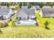 Aerial view of house with private pool and fenced backyard in a residential neighborhood at 1459 Tiger Grand Dr., Conway, SC 29526