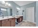 Double vanity bathroom with dark wood cabinets and tile flooring at 1459 Tiger Grand Dr., Conway, SC 29526