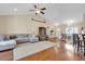 Open living room showcasing hardwood floors and a sectional sofa at 1459 Tiger Grand Dr., Conway, SC 29526
