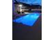 Inviting, illuminated inground pool at night in a backyard setting at 1459 Tiger Grand Dr., Conway, SC 29526