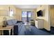 Living room with ocean view, sofa, and TV at 7100 Ocean Blvd. N # 925, Myrtle Beach, SC 29572