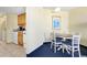 Bright dining area with table and chairs, adjacent to a kitchenette at 7100 Ocean Blvd. N # 925, Myrtle Beach, SC 29572