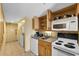 Compact kitchen with appliances and granite countertops at 7100 Ocean Blvd. N # 925, Myrtle Beach, SC 29572