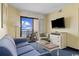 Living room with ocean view, sofa, and TV at 7100 Ocean Blvd. N # 925, Myrtle Beach, SC 29572
