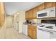 Small kitchen with laundry in hallway at 7100 Ocean Blvd. N # 925, Myrtle Beach, SC 29572