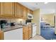 Kitchenette with granite counters and living room view at 7100 Ocean Blvd. N # 925, Myrtle Beach, SC 29572