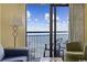 Living room with comfortable seating and a balcony overlooking the ocean at 7100 Ocean Blvd. N # 925, Myrtle Beach, SC 29572