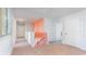 Upstairs hallway with coral accent wall and carpet at 192 Hadley Springs Ave, Longs, SC 29568