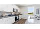 Kitchen features white cabinets, granite countertops, and stainless steel appliances at 192 Hadley Springs Ave, Longs, SC 29568