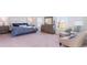 Large main bedroom with two seating chairs and en-suite bathroom at 192 Hadley Springs Ave, Longs, SC 29568