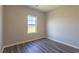 Bright bedroom featuring hardwood floors and a large window at 2323 King Farm Rd., Aynor, SC 29511