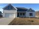Newly constructed home with gray and white siding, two-car garage, and small front yard at 2323 King Farm Rd., Aynor, SC 29511