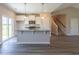 Modern kitchen with white cabinets, granite countertops, stainless steel appliances, and an island at 2323 King Farm Rd., Aynor, SC 29511