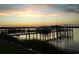Scenic sunset view over calm waters with boats at the dock at 2323 King Farm Rd., Aynor, SC 29511