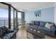 Living room with ocean view, sofa, and dining table at 201 74Th Ave. N # 2829, Myrtle Beach, SC 29572