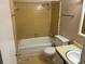 Clean bathroom with yellow tile, bathtub, toilet, and sink at 1025 Carolina Rd. # G-3, Conway, SC 29526