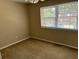 Spacious bedroom with neutral walls, carpeting, and a window with blinds at 1025 Carolina Rd. # G-3, Conway, SC 29526