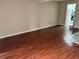 Spacious living room with dark laminate flooring and access to the kitchen at 1025 Carolina Rd. # G-3, Conway, SC 29526