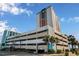 Oceanfront building with parking and palm trees at 1605 S Ocean Blvd. # 1104, Myrtle Beach, SC 29577