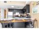 Modern kitchen with dark cabinets and island at 1605 S Ocean Blvd. # 1104, Myrtle Beach, SC 29577