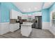 Modern kitchen with granite countertops, white cabinets, and a kitchen island at 6001-N37 S Kings Hwy., Myrtle Beach, SC 29575