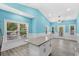 Open concept kitchen with granite island and light blue walls at 6001-N37 S Kings Hwy., Myrtle Beach, SC 29575