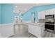 Modern kitchen with white cabinets, granite countertops, and stainless steel appliances at 6001-N37 S Kings Hwy., Myrtle Beach, SC 29575