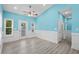 Versatile bonus room with light blue walls and wood-look floors at 6001-N37 S Kings Hwy., Myrtle Beach, SC 29575