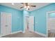 Spacious bedroom with light blue walls, white doors and wood-look floors at 6001-N37 S Kings Hwy., Myrtle Beach, SC 29575
