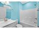 Clean bathroom with white tub/shower combo, white vanity, and light blue walls at 6001-N37 S Kings Hwy., Myrtle Beach, SC 29575