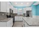 Modern kitchen with white cabinets, granite countertops, and stainless steel appliances at 6001-N37 S Kings Hwy., Myrtle Beach, SC 29575