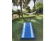 Outdoor space with cornhole and a hammock under palm trees at 5308 N Ocean Blvd. # 812, Myrtle Beach, SC 29577