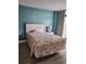 Bedroom with a floral comforter and hardwood floors at 5308 N Ocean Blvd. # 812, Myrtle Beach, SC 29577