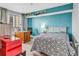 Spacious bedroom with a built-in desk and teal accent wall at 5308 N Ocean Blvd. # 812, Myrtle Beach, SC 29577
