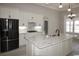 Modern kitchen featuring white cabinets, granite countertops, and stainless steel appliances at 1100 Maccoa Dr., Conway, SC 29526