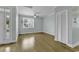 Bright and airy living room with hardwood floors and large window at 6 Cottage Dr., Murrells Inlet, SC 29576