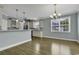 Open concept kitchen and dining area with hardwood floors and modern fixtures at 6 Cottage Dr., Murrells Inlet, SC 29576