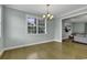 Bright dining room with hardwood floors and a view into the living room at 6 Cottage Dr., Murrells Inlet, SC 29576