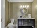 Modern powder room with gold accents and marble vanity at 6 Cottage Dr., Murrells Inlet, SC 29576