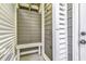 Convenient outdoor shower with wood bench and privacy slats at 6 Cottage Dr., Murrells Inlet, SC 29576