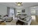Comfortable living room featuring plush sofas and access to a balcony at 6 Cottage Dr., Murrells Inlet, SC 29576